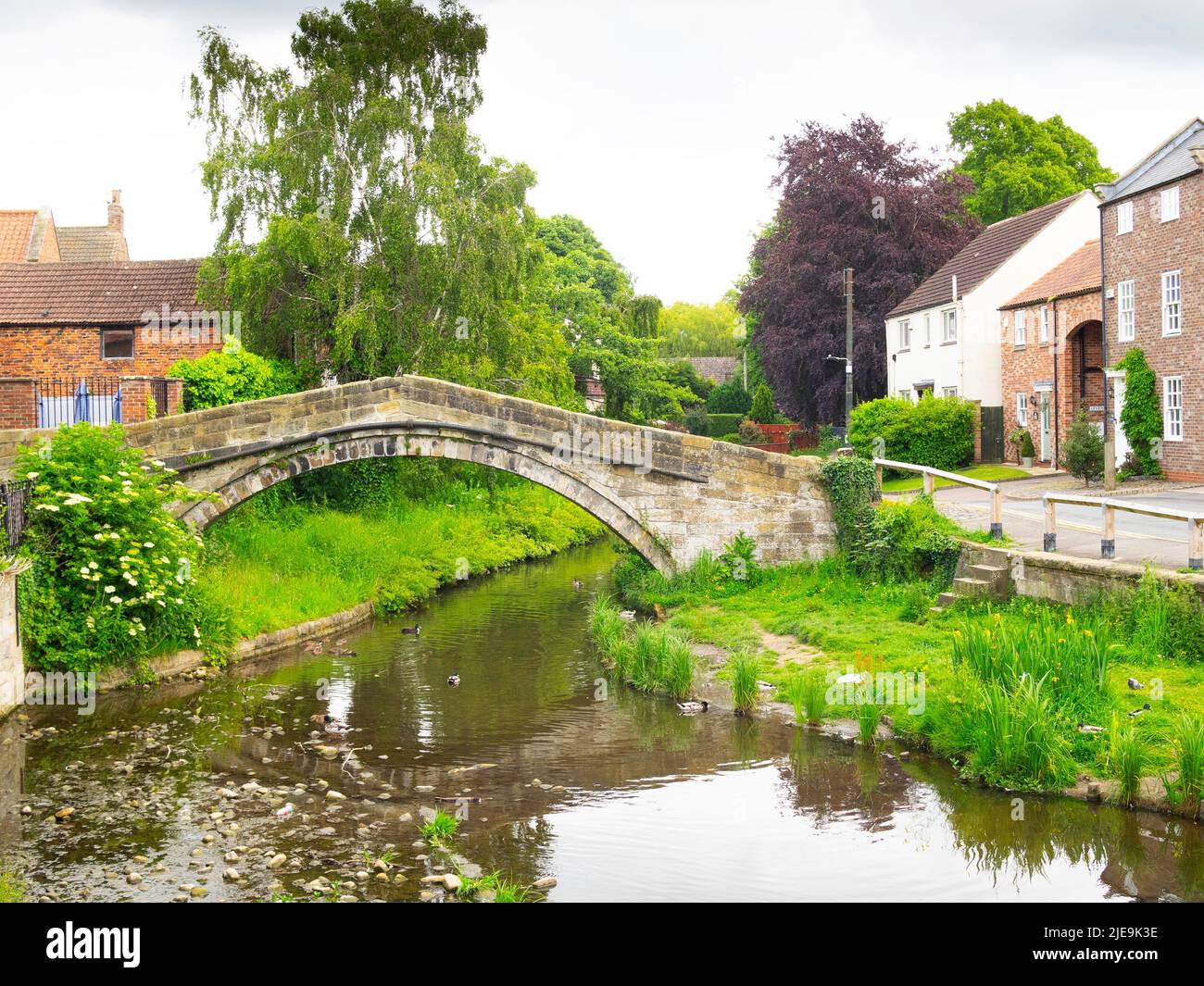 The 17C pack horse bridge over the river Leven in Stokesley North Yorkshire, on the old packhorse route from Durham to York Stock Photo