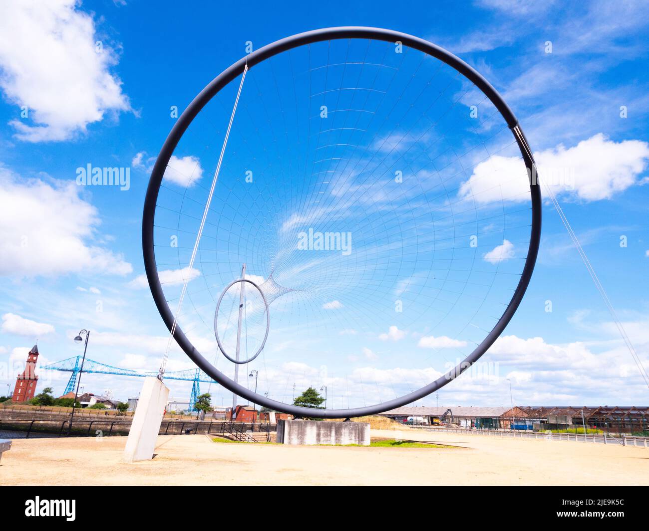 Temenos the  Middlesbrough public art installation by artist Anish Kapoor with the Transporter bridge behind Stock Photo
