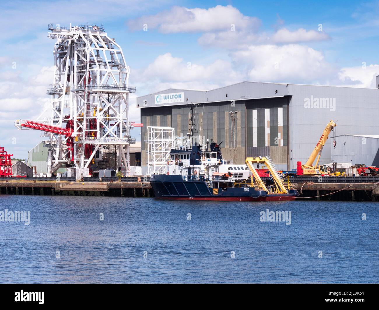 The quayside at Wilton Group fabrication yard with a white painted underwater structure at  Port Clarnce on the River Tees Stock Photo