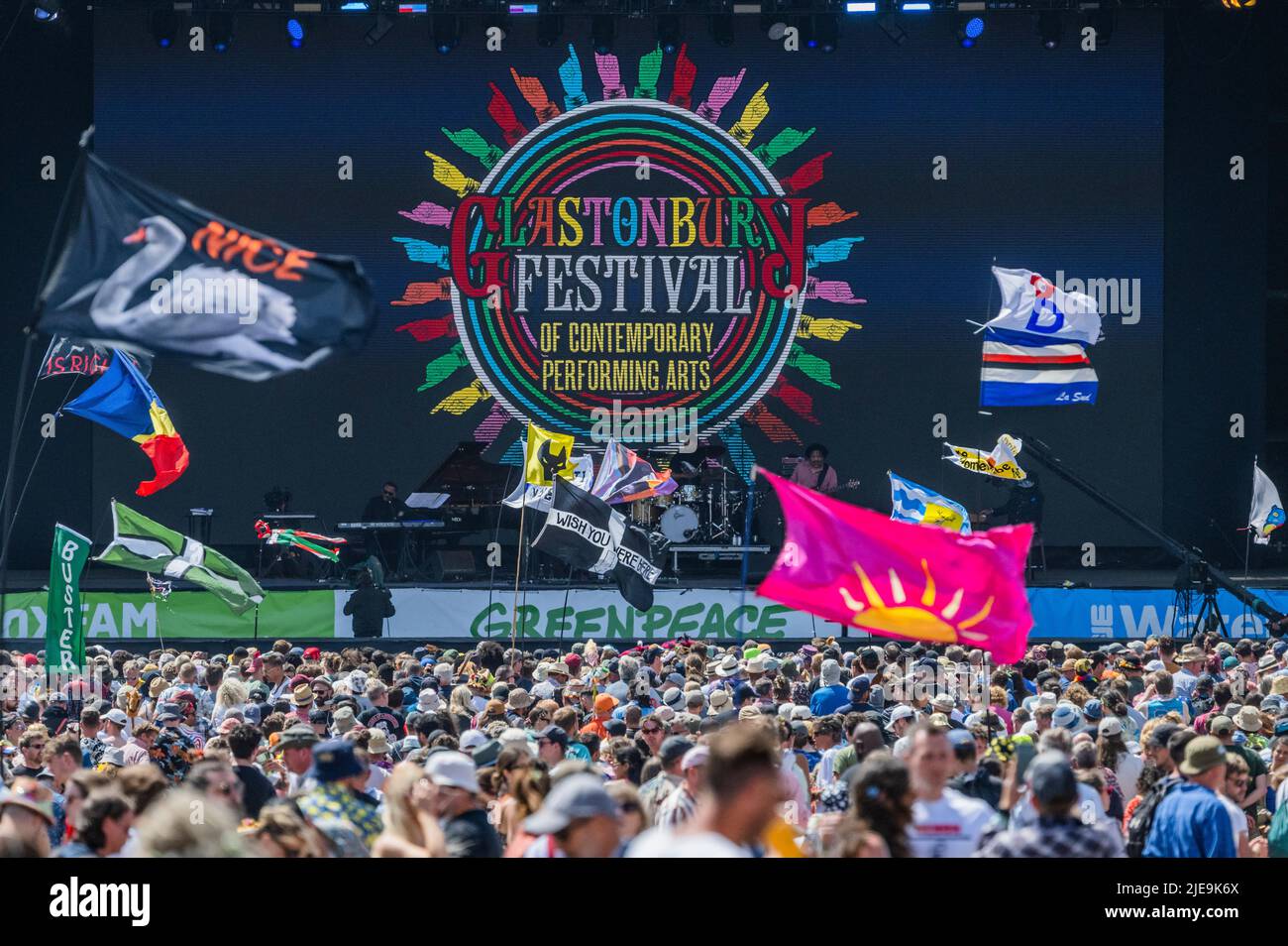 Glastonbury, UK. 26th June, 2022. Flags, including Wish you were here and a Diana Ross LGBT one, as Herbie Hancok plays the Pyramid stage - The 50th 2022 Glastonbury Festival, Worthy Farm. Glastonbury, Credit: Guy Bell/Alamy Live News Stock Photo