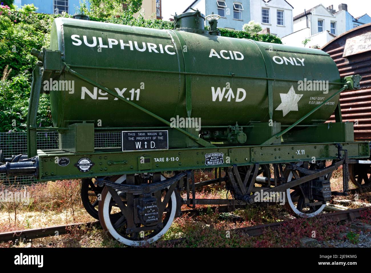 Old second world war train truck for transporting sulphuric acid, besides Floating Harbour, Bristol, England. Stock Photo