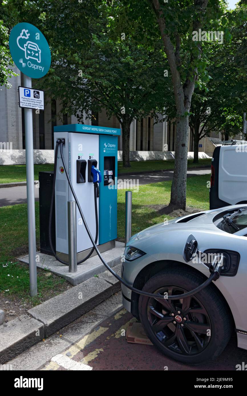 Electric car charging at charging point, Cathays Park, Cardiff, Wales. Stock Photo