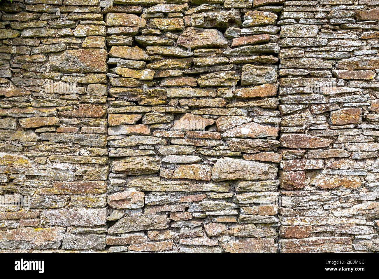 The remains of a very old stone wall of an derelict house in the Brecon Beacons in South Wales UK Stock Photo