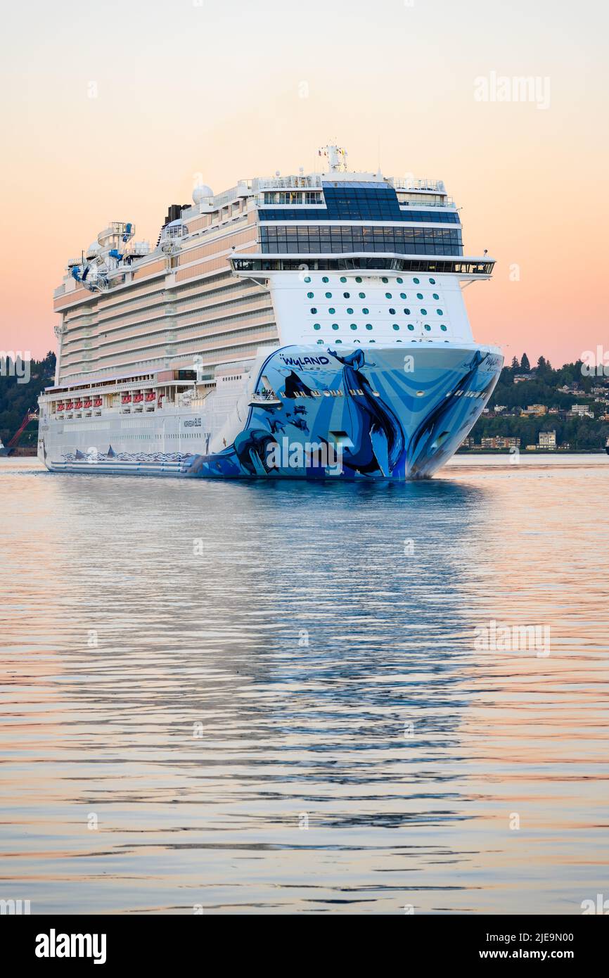 Seattle - June 25, 2022; NCL Cruise ship Norwegian Bliss turning in Elliott Bay as it  approaches the Seattle waterfront at dawn after Alaska trip Stock Photo