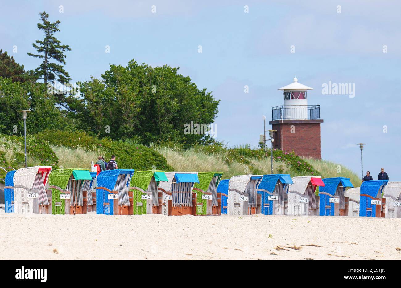 Colorful beach chairs at the lighthouse  on Juni 21, 2022  in Wyk, Foehr Island, Germany.  © Peter Schatz / Alamy Stock Photos Stock Photo