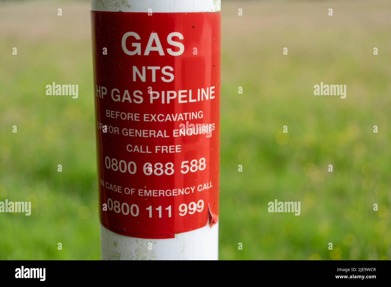 NTS or National Transmission Service national gas supply pipeline marker alongside a path in the UK. Stock Photo