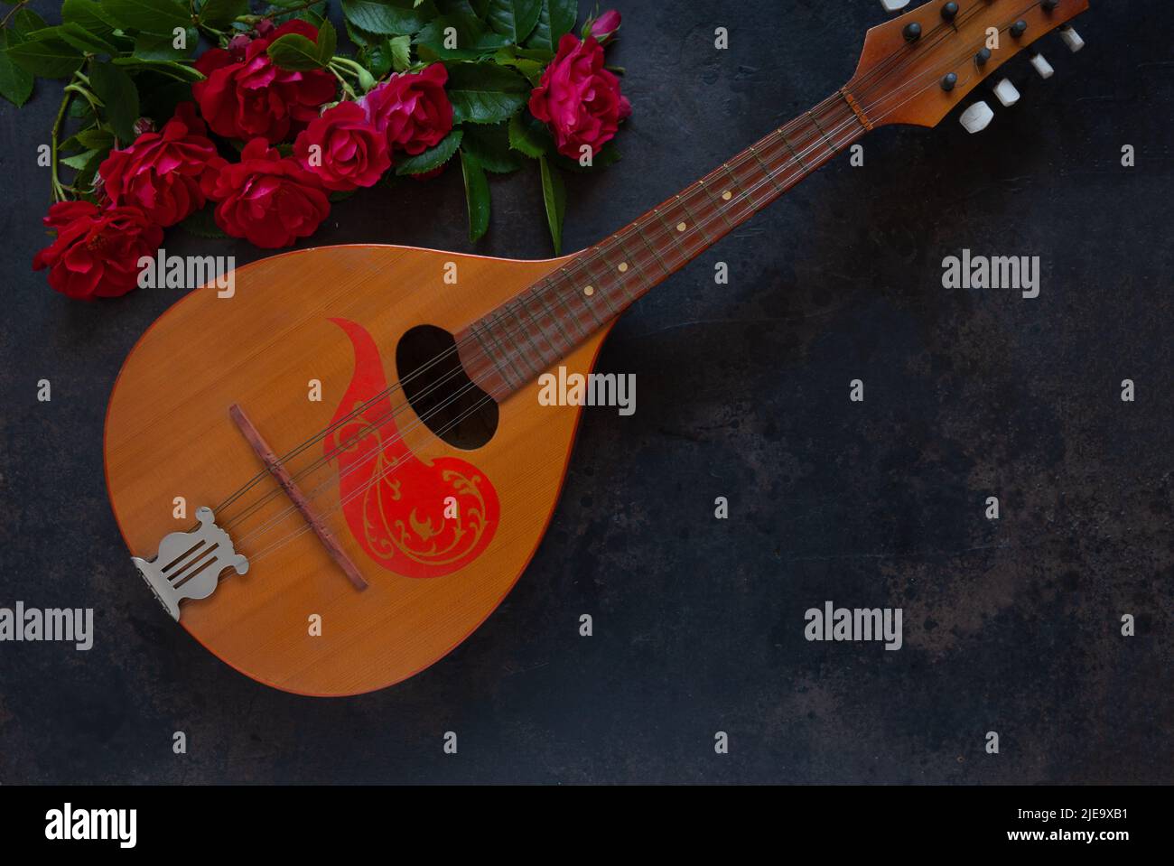 Mandolin a stringed plucked musical instrument and a beautiful red