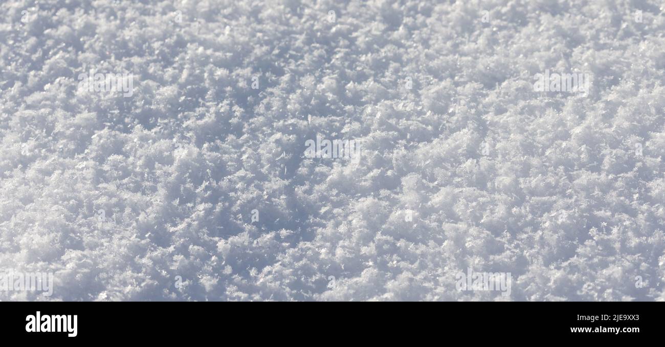 Macro view crystal snowflakes. Winter season decorative nature frame snow texture. shallow depth of field. Stock Photo