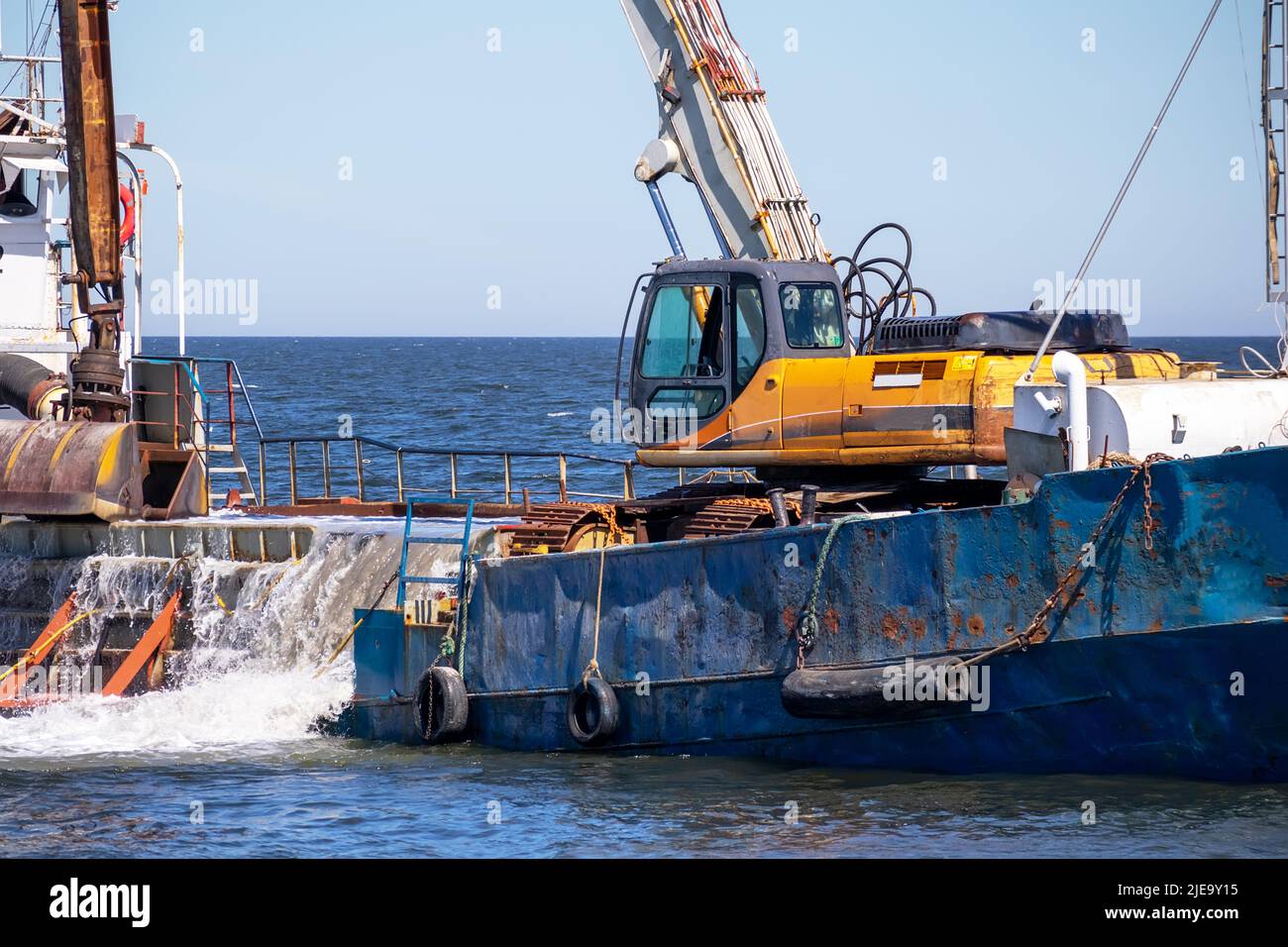 Dredging vessel in the Baltic Sea, at sea with excavation works Stock Photo