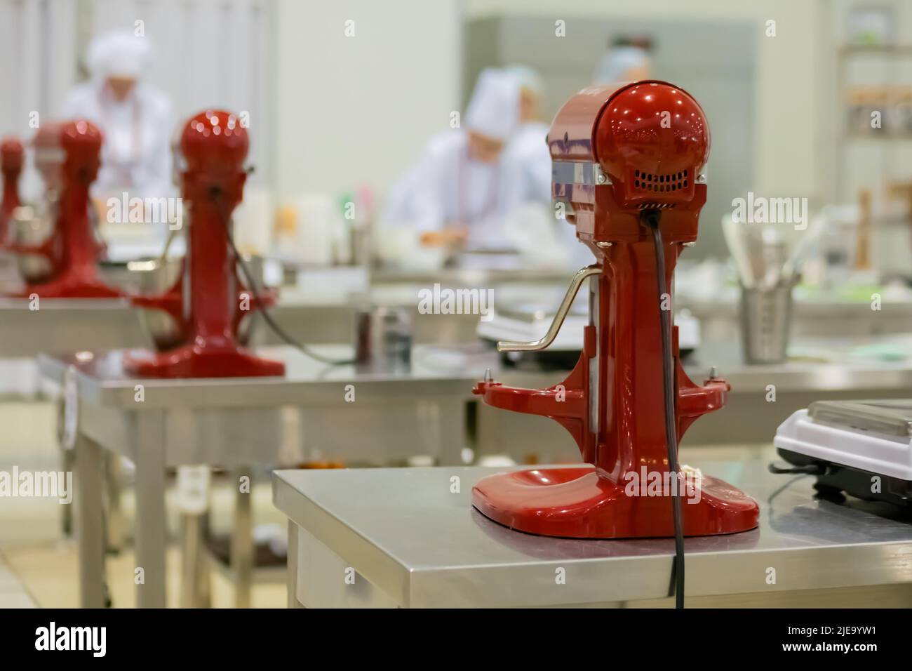 Professional chef workplace with modern food mixers at cuisine of