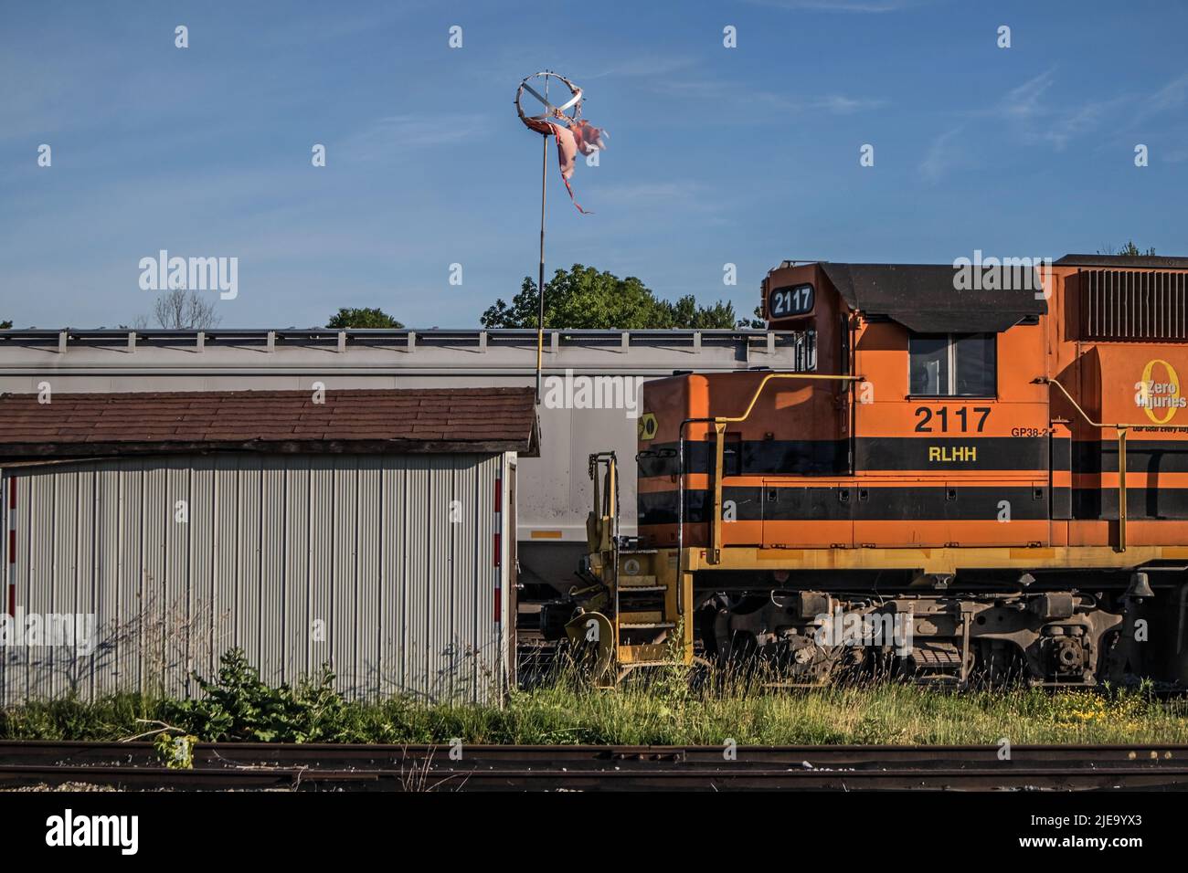 A locomotive and a ragged weather vane at the rail terminal. Canada. Stock Photo