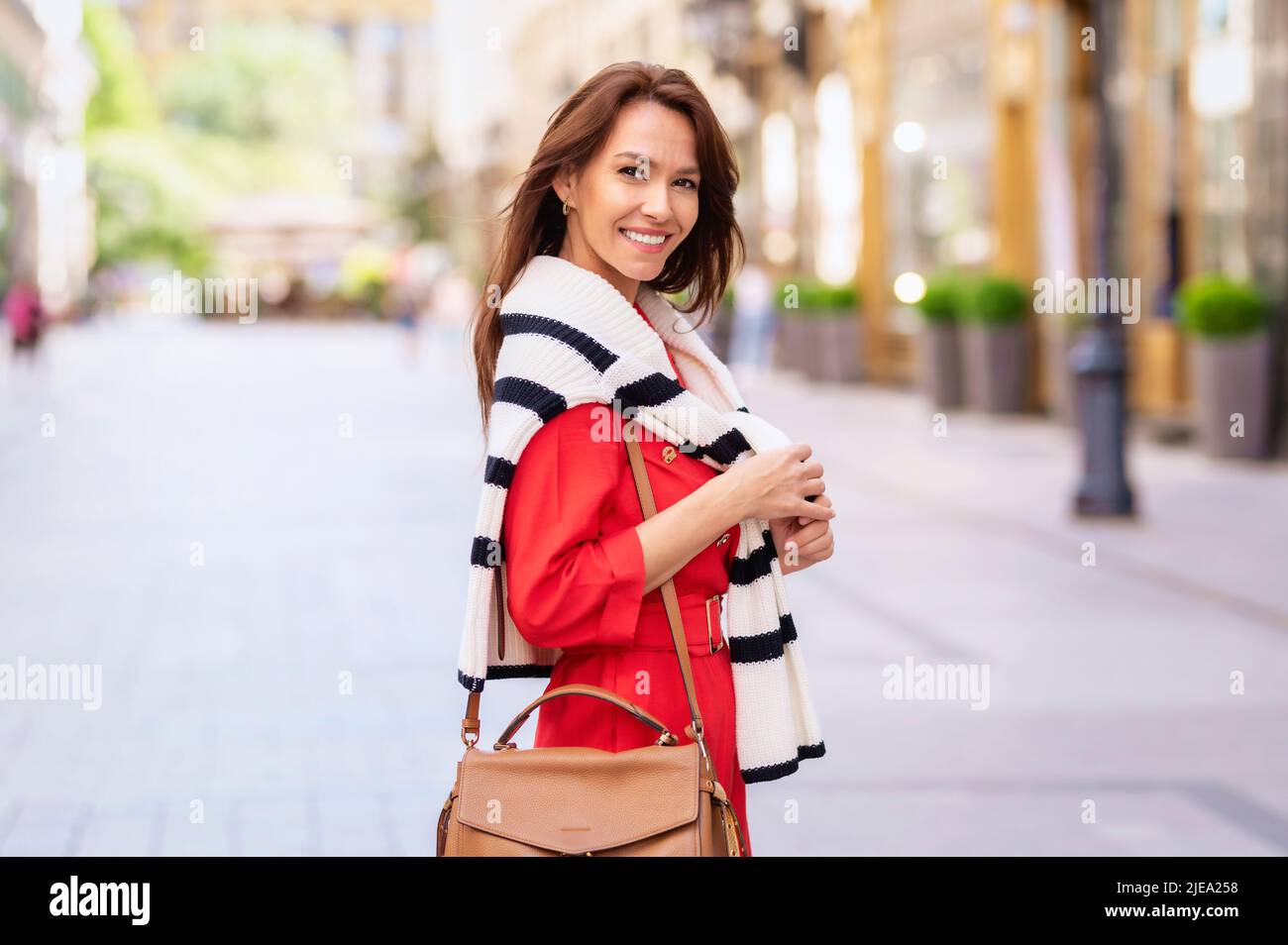 Attractive middle aged woman walking hi-res stock photography and ...