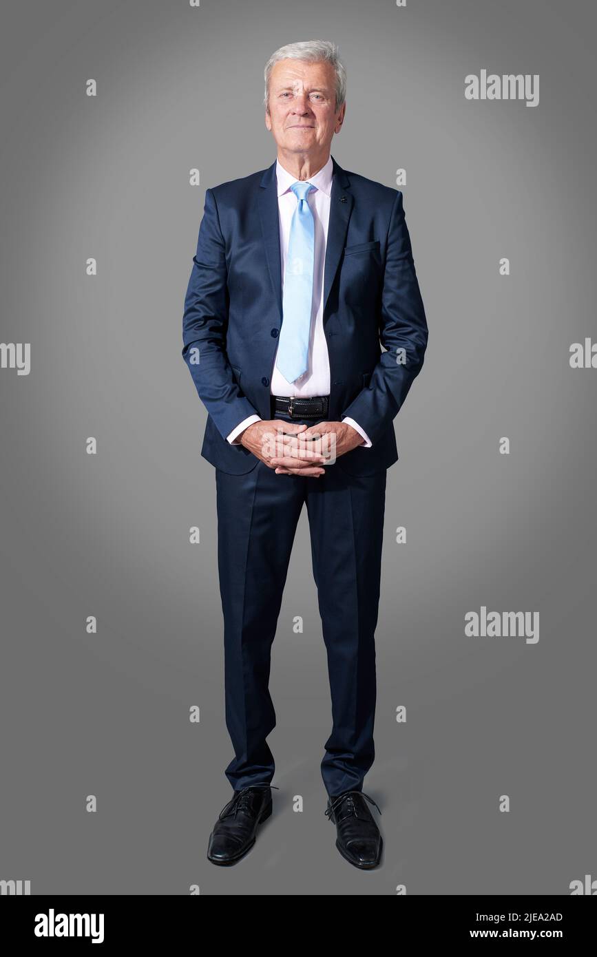 Studio shot of executive senior businessman wearing suit and tie while ...