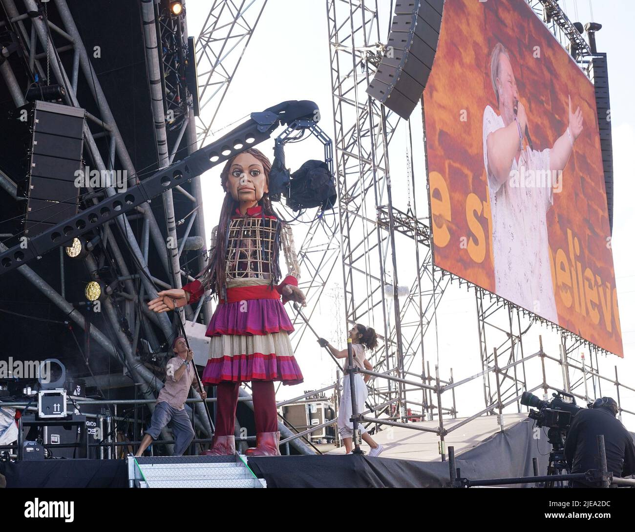 Puppet Little Amal on the Pyramid Stage during the set from Elbow at