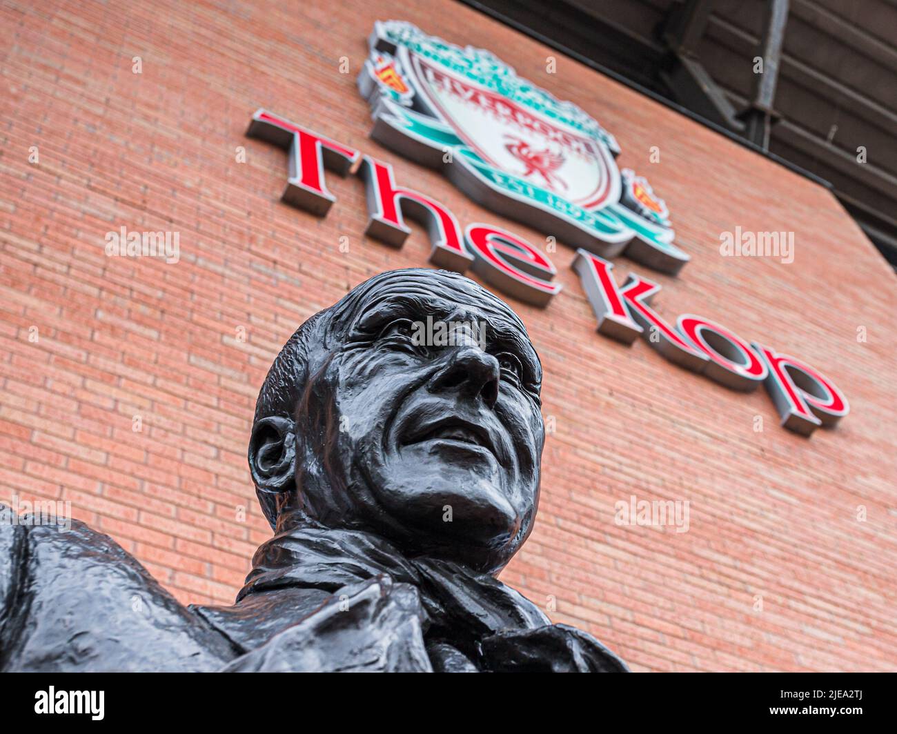 Looking up at the Bill Shankly statue outside The Kop stand at Anfield Stadium in Liverpool, seen in June 2022. Stock Photo
