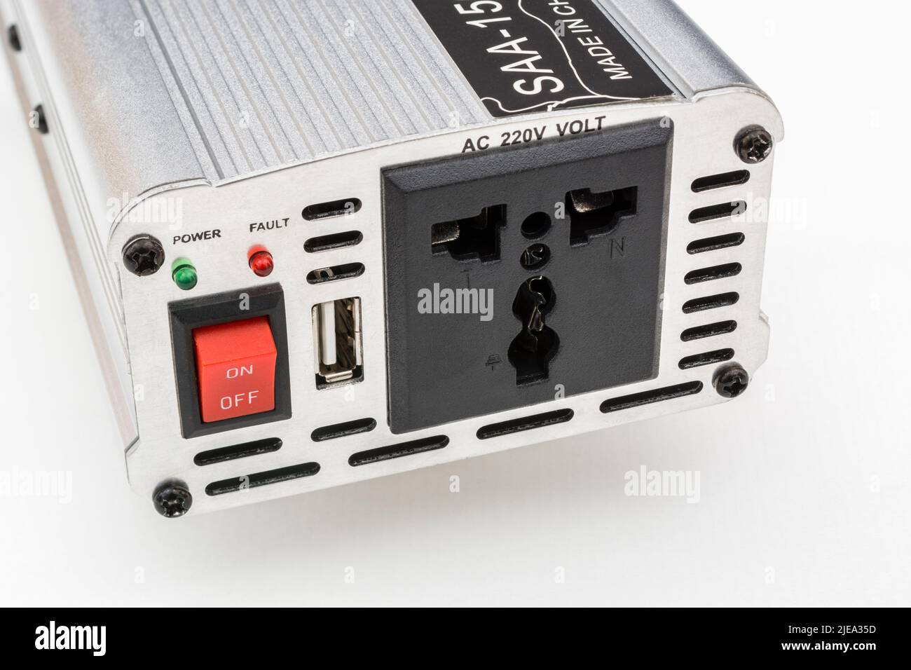 1500w / Watt DC to AC inverter unit made in China. Red On-Off switch and 3-pin AC power plug socket visible, along with USB charging point socket. Stock Photo