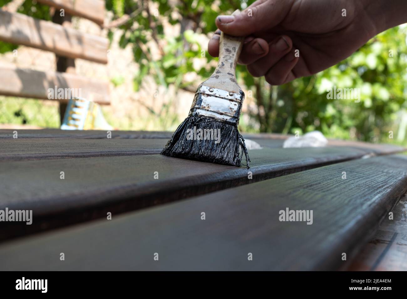 painting wooden parts for doors, applying varnish with a brush Stock