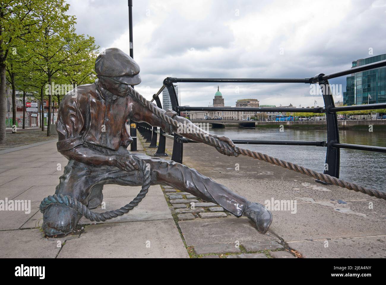 The Linesman bronze statue (by Dony Mac Manus) on the Liffey riverbank, Dublin, Ireland Stock Photo