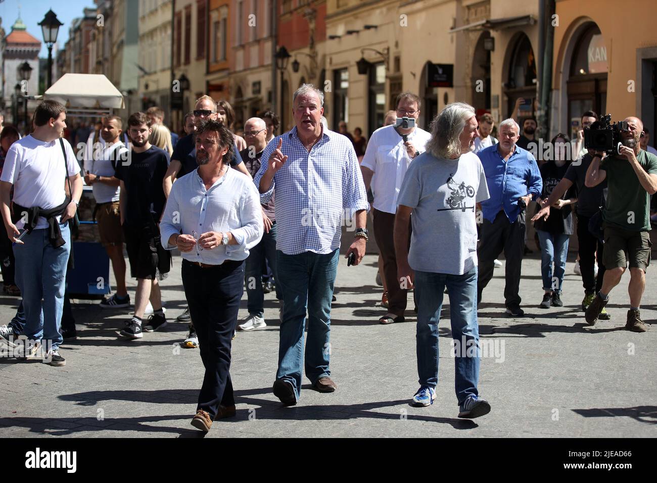 The Grand Tour stars, Jeremy Clarkson, Richard Hammond and James May, walk along the Main Square in Cracow, Poland, while on tour filming the show. The Grand Tour is a British motoring television series, created by Jeremy Clarkson, Richard Hammond, James May, and Andy Wilman, made for Amazon exclusively for its online streaming service Amazon Prime Video which premiered in 2016. The programme was conceived in the wake of the departure of Clarkson, Hammond, May and Wilman from the BBC series Top Gear. (Photo by Vito Corleone/SOPA Images/Sipa USA) Stock Photo