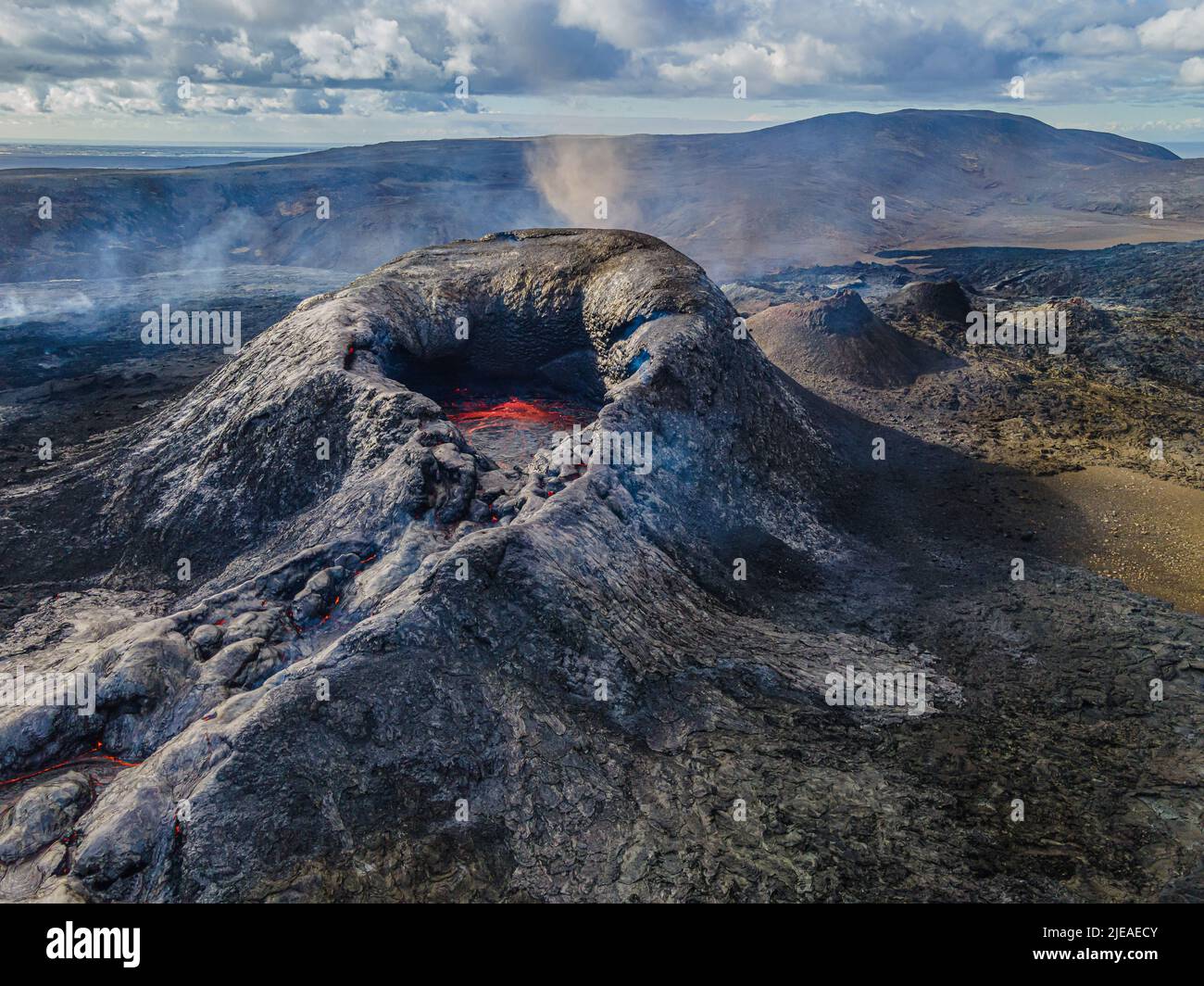 active volcano on the Reykjanes Peninsula of Iceland. Volcanic crater with liquid magma. Liquid lava in the center of the crater just before eruption. Stock Photo