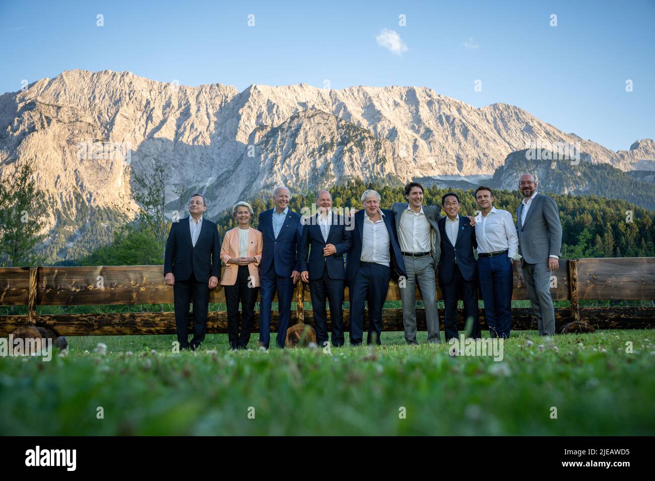 26 June 2022, Bavaria, Elmau: The leaders lined up for an informal group photo at the 'Merkel - Obama' bench after dinner at the G7 meeting at Schloss Elmau. Mario Draghi, Prime Minister of Italy, Ursula von der Leyen, EU Commission President, US President Joe Biden, German Chancellor Olaf Scholz (SPD), Boris Johnson, Prime Minister of Great Britain, Justin Trudeau, Prime Minister of Canada, Fumio Kishida, Prime Minister of Japan, Emmanuel Macron, President of France, Charles Michel, EU Council President. Germany is hosting the G7 summit of economically strong democracies. On the first day of Stock Photo