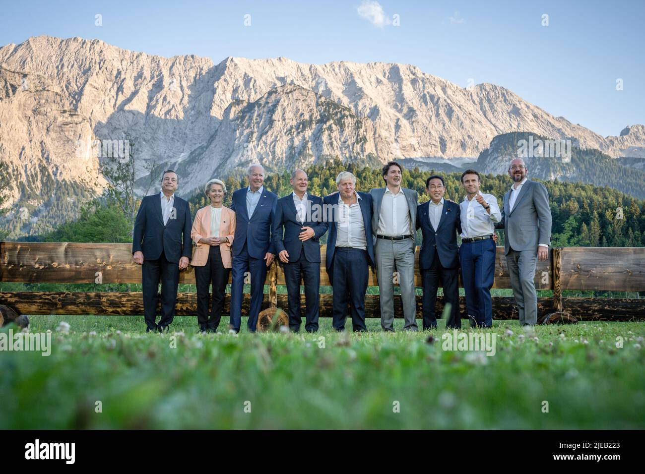 26 June 2022, Bavaria, Elmau: The leaders lined up for an informal group photo at the 'Merkel - Obama' bench after dinner at the G7 meeting at Schloss Elmau. Mario Draghi, Prime Minister of Italy, Ursula von der Leyen, EU Commission President, US President Joe Biden, German Chancellor Olaf Scholz (SPD), Boris Johnson, Prime Minister of Great Britain, Justin Trudeau, Prime Minister of Canada, Fumio Kishida, Prime Minister of Japan, Emmanuel Macron, President of France, Charles Michel, EU Council President. Germany is hosting the G7 summit of economically strong democracies. On the first day of Stock Photo