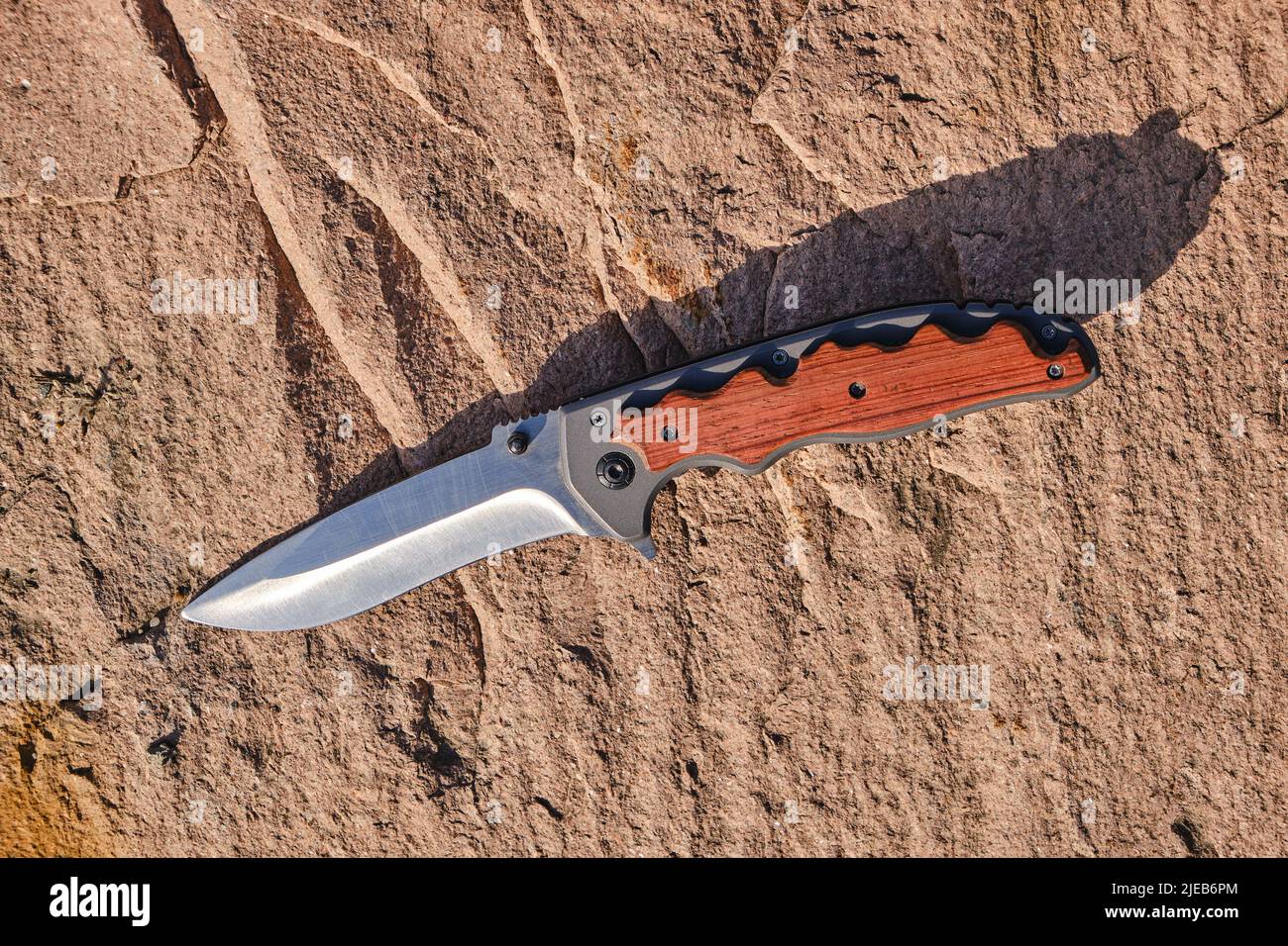 Tactical knife survival and protection difficult conditions, on stone