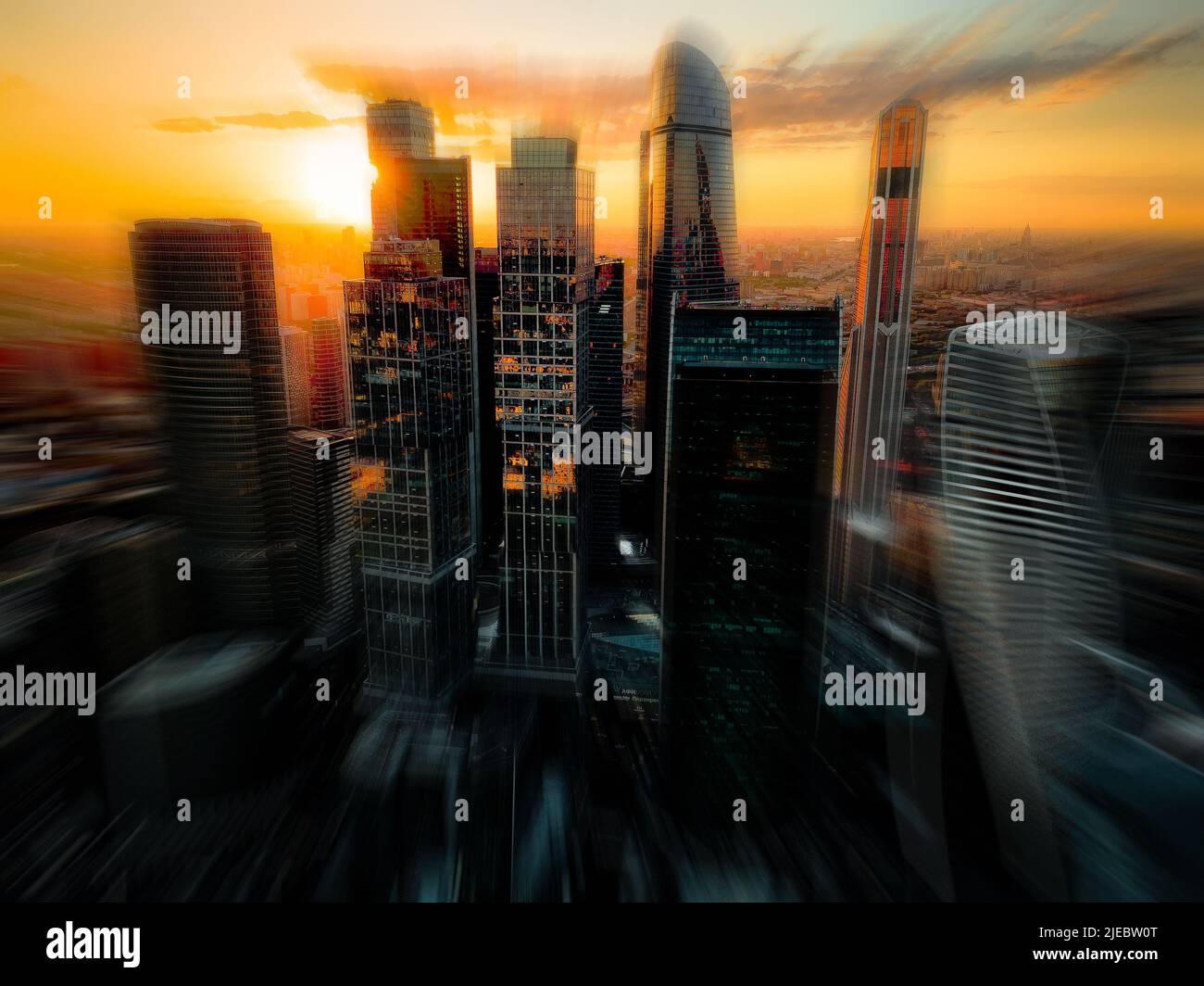 Skyscrapers of Moscow City business centre at sunset. Aerial view of Moscow city skyline and skyscraper building with motion blur effect Stock Photo