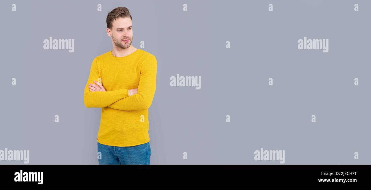 Put on confidence. Confident man grey background. Fashion man keep arms crossed. Man face portrait, banner with copy space. Stock Photo