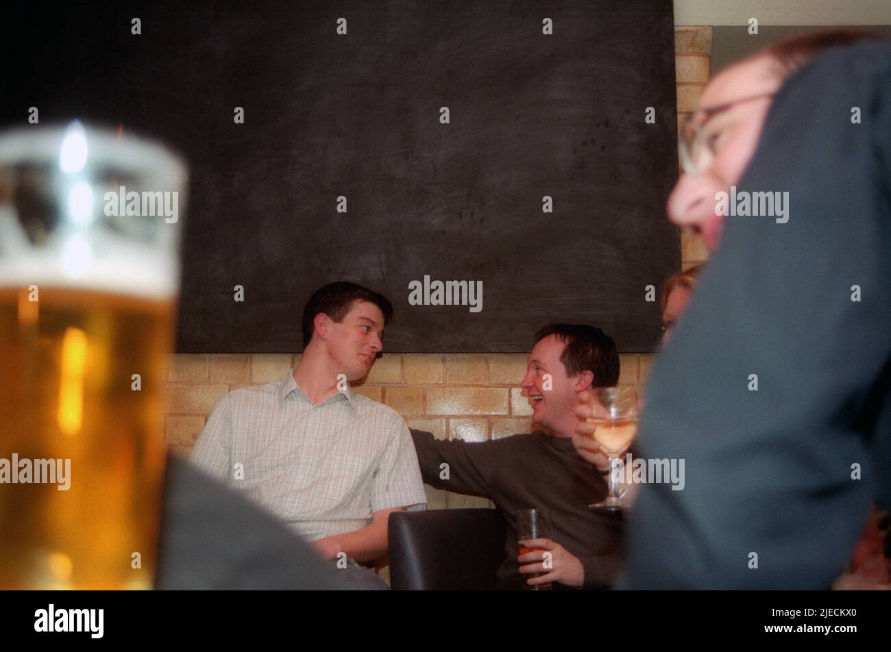 Young men drinking in a pub Stock Photo