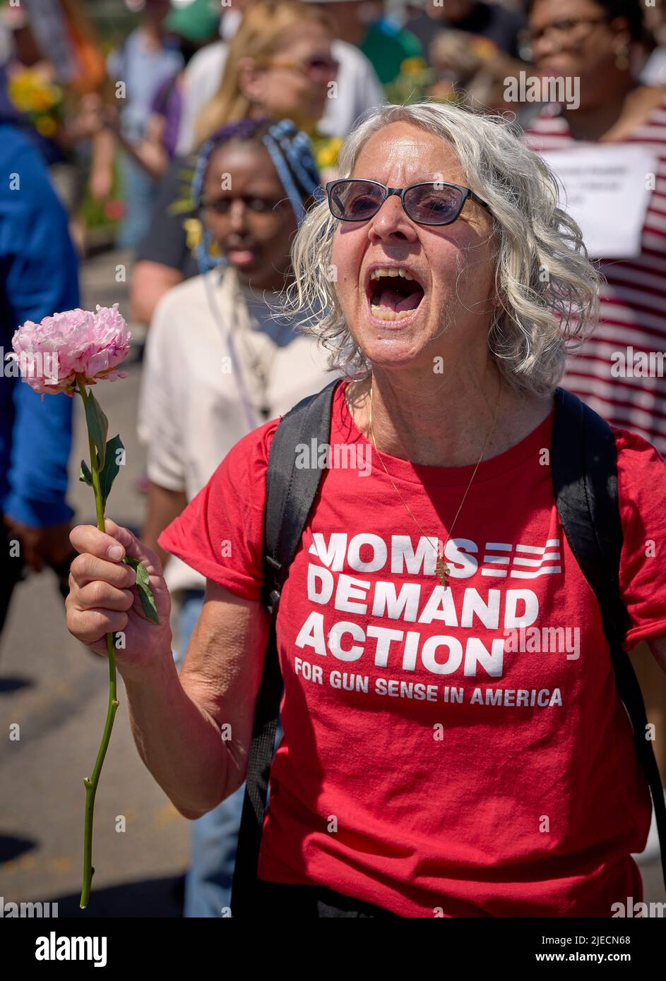 Demanding action against gun violence, a woman walks in a June 26, 2022, March Against Fear in Eugene, Oregon, USA. Stock Photo