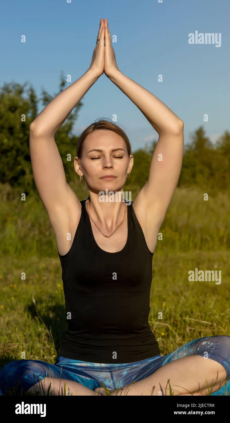 Portrait of a young woman doing yoga. Close up. Stock Photo