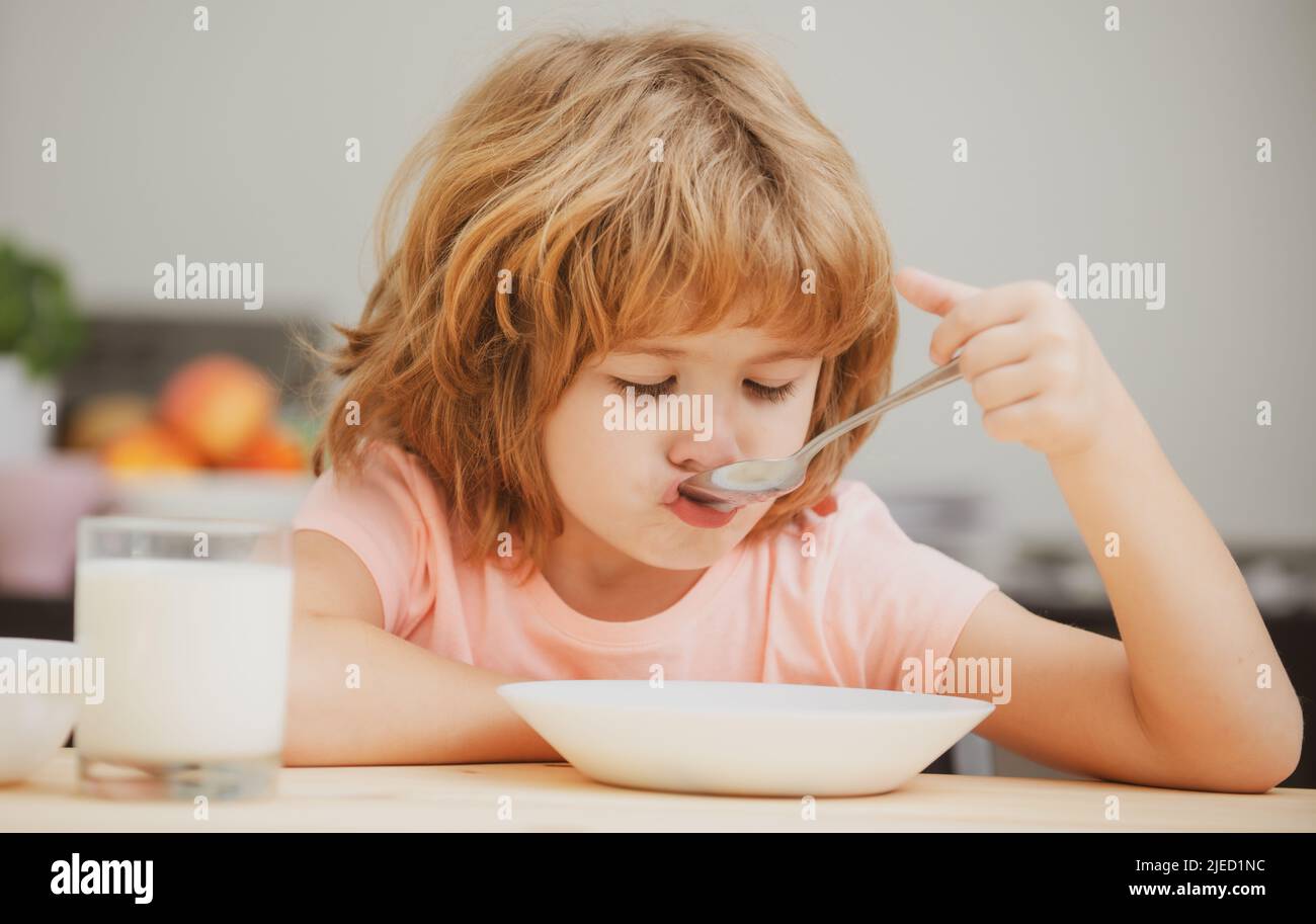 Child eating healthy food. Cute little boy having soup for lunch Stock Photo Alamy