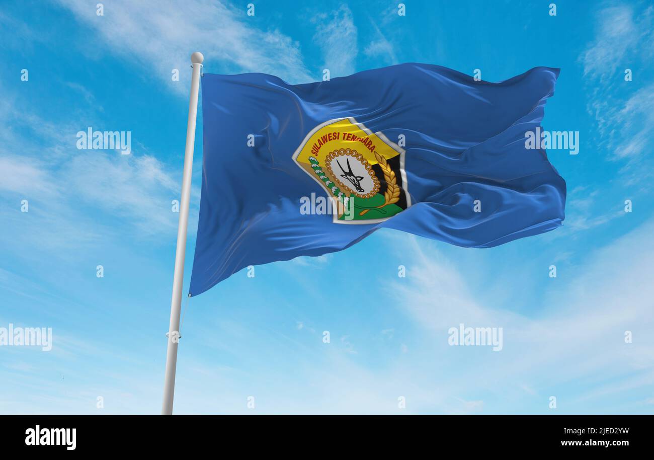 official flag of Southeast Sulawesi Indonesia at cloudy sky background on sunset, panoramic view. Indonesian travel and patriot concept. copy space fo Stock Photo
