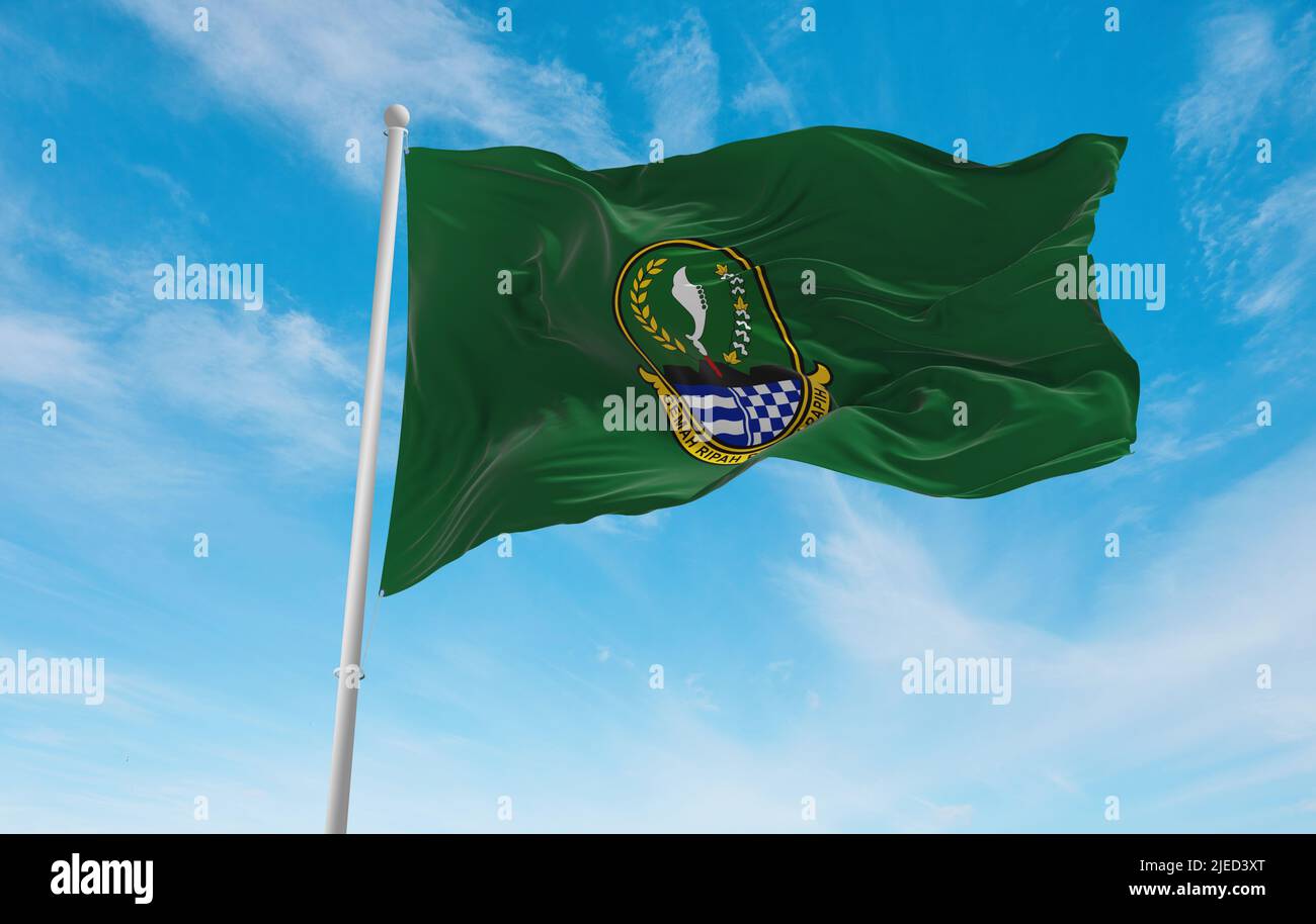 official flag of West Java Indonesia at cloudy sky background on sunset
