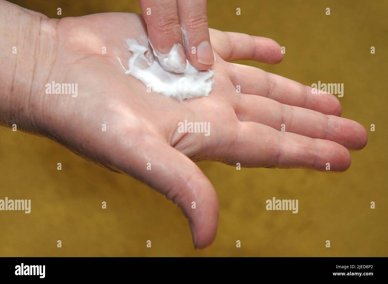 Hand skin care with hand cream for older women Stock Photo Alamy