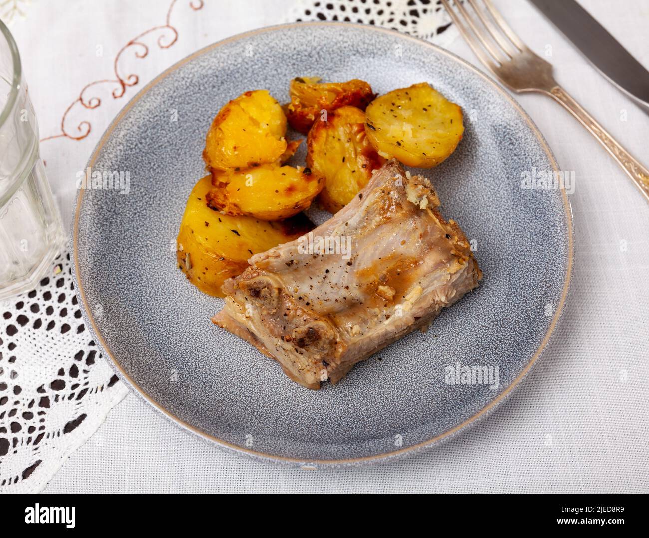Ccostillas de cerdo - pork ribs with boiled potatoes Stock Photo