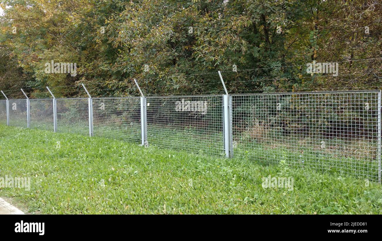 Barbed wire wall. Restricted area Stock Photo