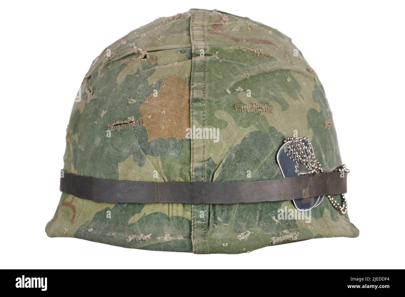US Army helmet Vietnam war period with camouflage cover and dog tags isolated on white Stock Photo