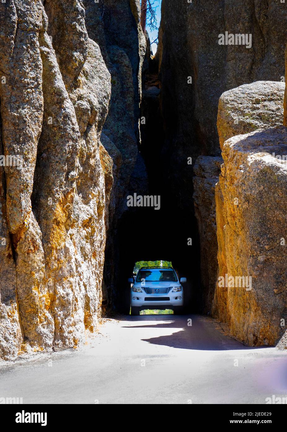 Car in Needles Eye Tunnel on the Needles Highway in Custer State Park