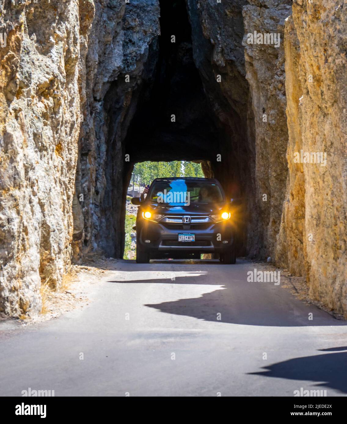 Car in Needles Eye Tunnel on the Needles Highway in Custer State Park in the Black Hills of