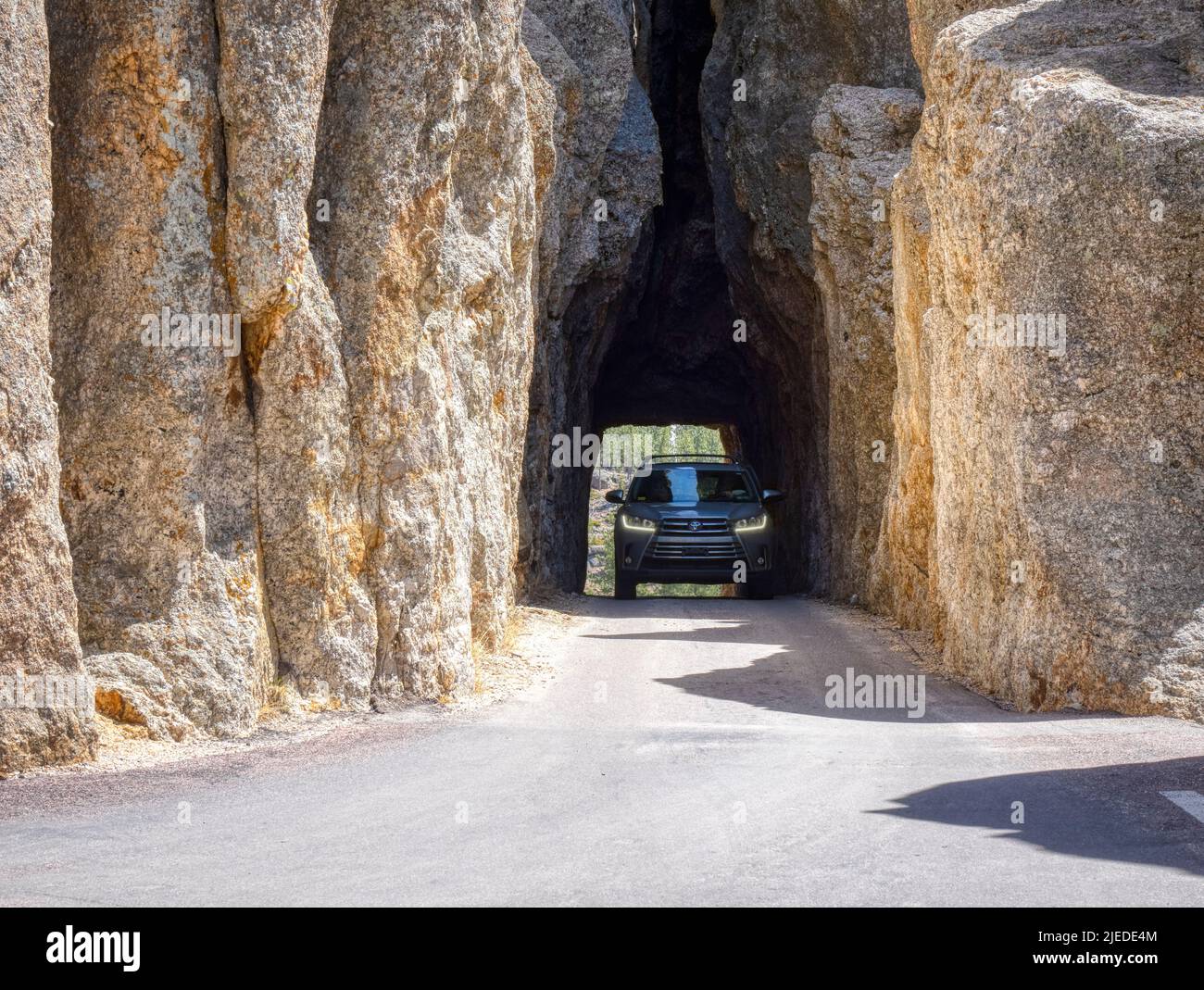 Car in Needles Eye Tunnel on the Needles Highway in Custer State Park