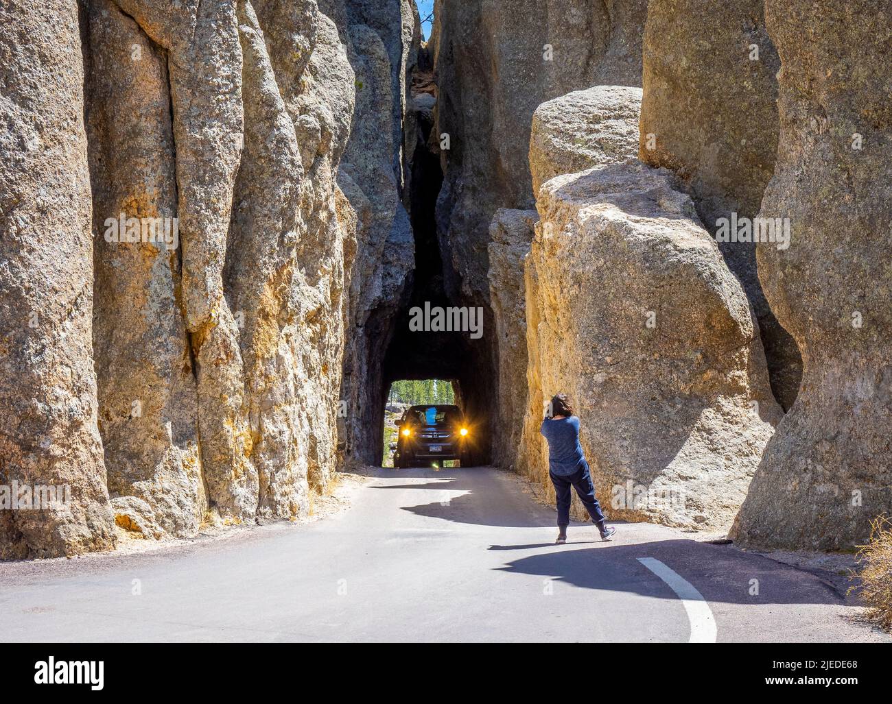 Car in Needles Eye Tunnel on the Needles Highway in Custer State Park