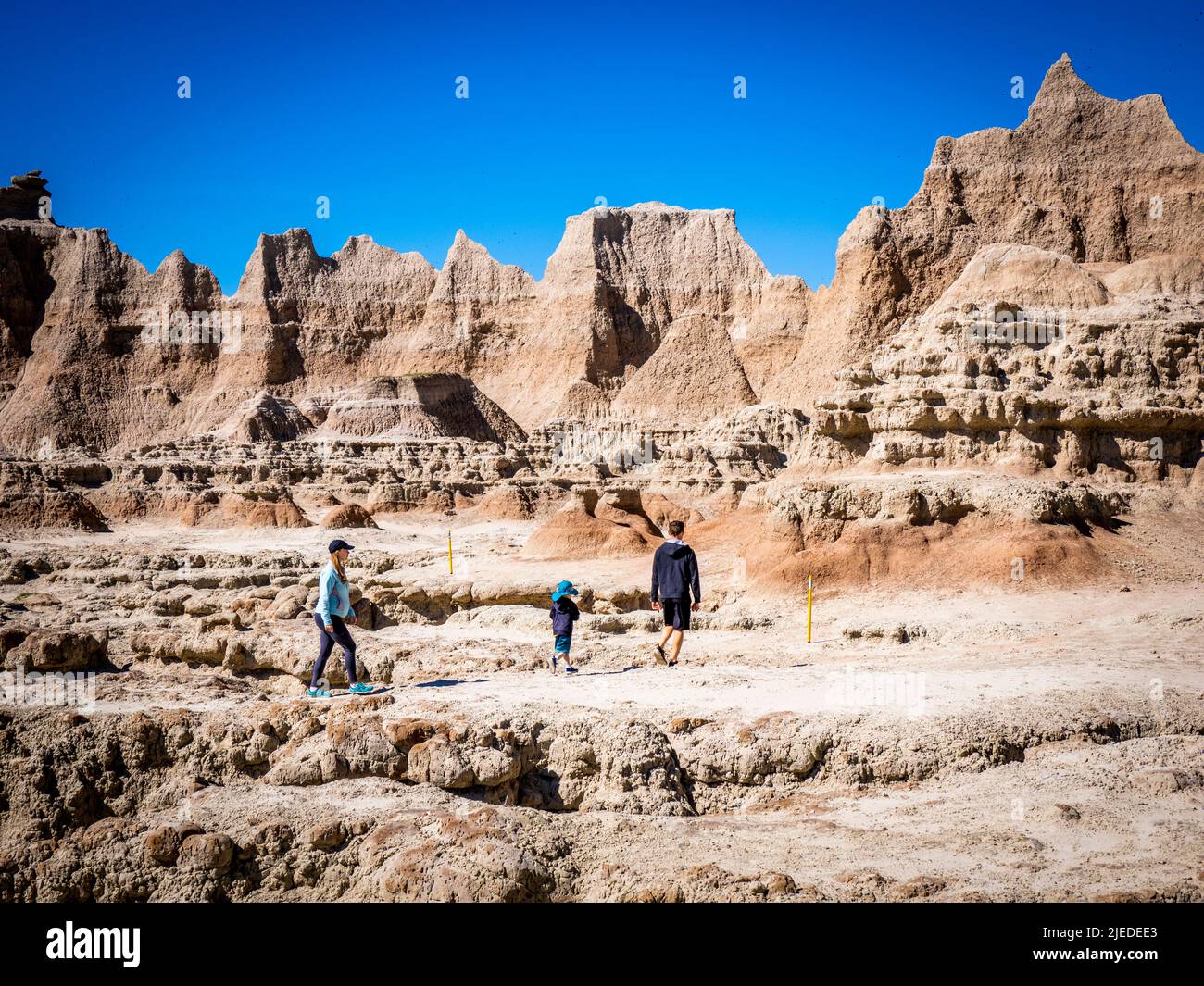 People on the Door Trail in Badlands National Park in South Dakota Stock Photo