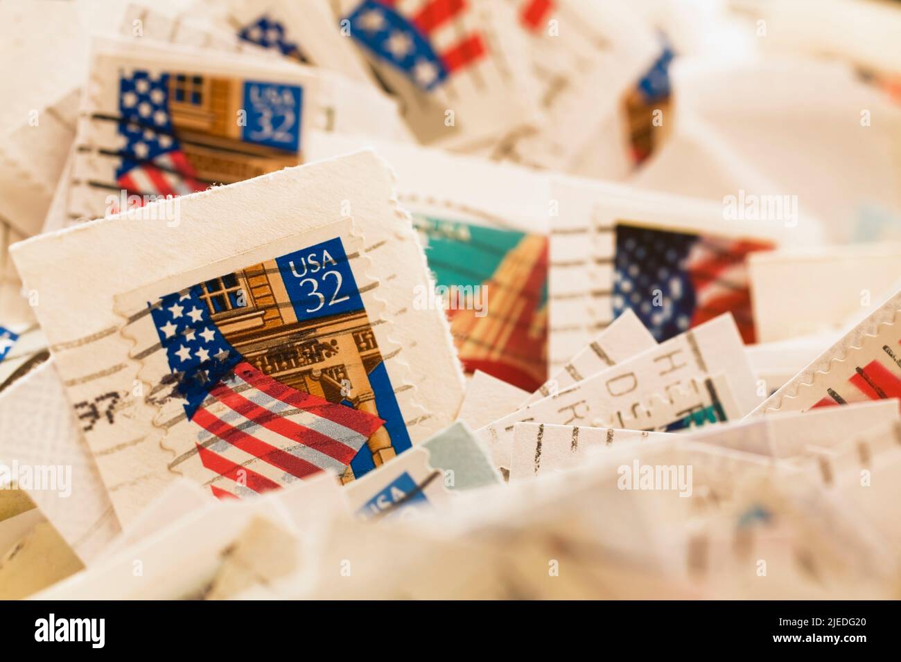Close-up of old United States postage stamps commemorating the US flag. Stock Photo