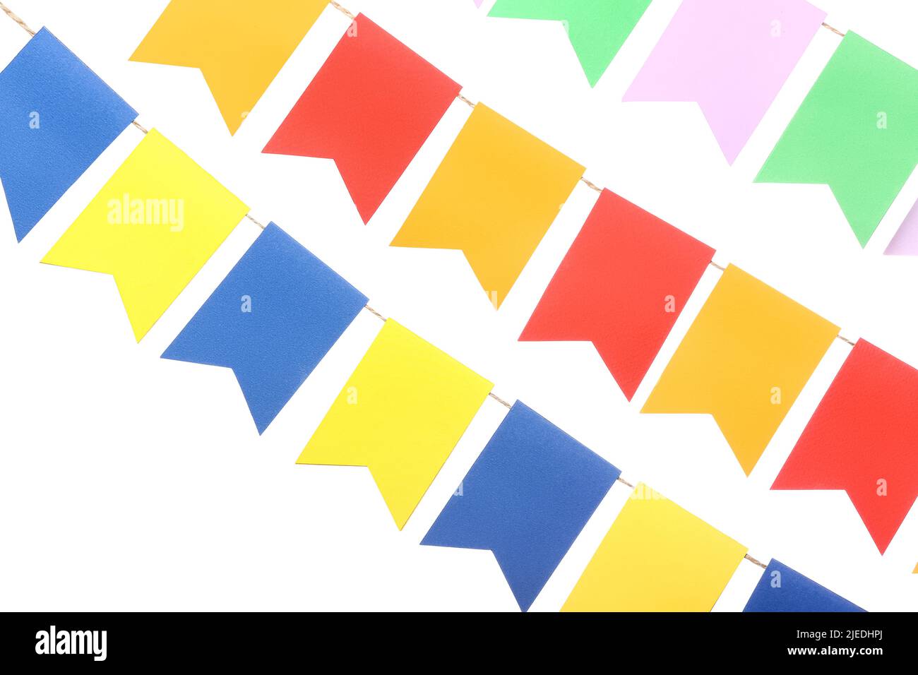 Colorful festive bunting flags on white background Stock Photo - Alamy