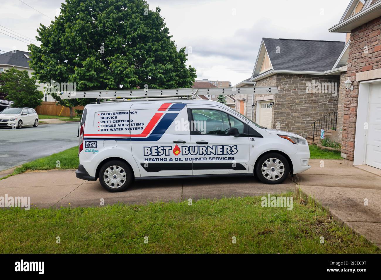 Best Burners service van parked in front of a house. Best Burners provides professional heating and oil burners. HALIFAX, NOVA SCOTIA, CANADA Stock Photo