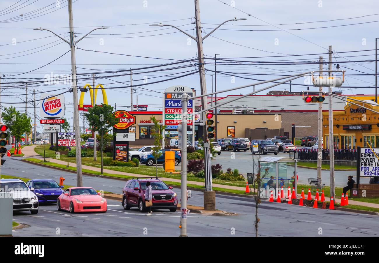 McDonalds, Pizza Delight, Burger King restaurants road side banners  in a single frame. An American chain of fast-food. HALIFAX, CANADA - JUNE 2022 Stock Photo