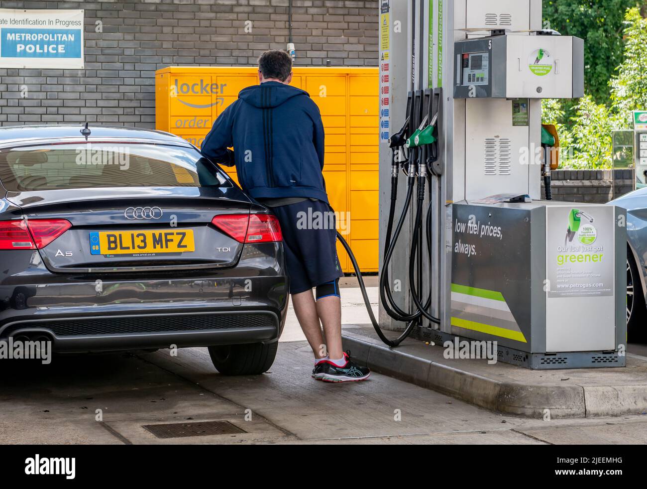 London. UK-06.26.2022. A driver filling up his car with fuel at a petrol station with the cost of fuel at a all time high. Stock Photo