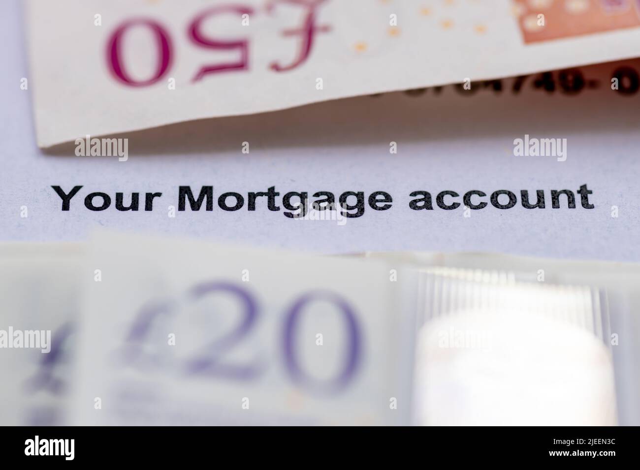 Close up of a mortgage account statement with bank notes. Mortgage borrowing, house buying, finance concept. Stock Photo